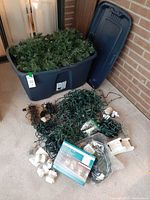 Tote, garland and loose lights on floor with packaged Sylvania microdot lights