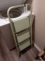 Folding ladder closed showing frame and steps