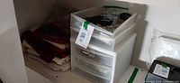 Drawer unit with fabric stack and top tray of notions visible