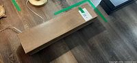Shelf on floor showing top and grain finish