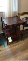 Full view of side table showing two tiers, drawer, legs and finish