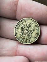 Reverse showing date 1940, thrift plant and THREE PENCE legend