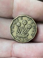 Reverse showing THREE PENCE 1942 thrift plant design