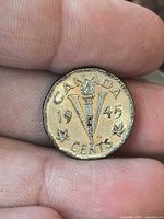 Reverse showing CANADA, 1945, torch V design
