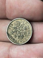Reverse floral emblem side showing date and denomination