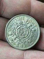 Reverse showing Tudor rose and national emblems, date 1966