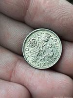 Reverse side showing 1967 date and floral emblems
