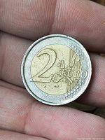 Common reverse of 2 Euro coin showing denomination and map