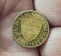 Obverse of 1965 Austria 50 Groschen coin showing shield and legend