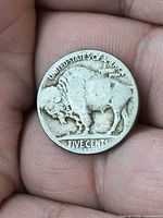 Reverse side showing buffalo design and FIVE CENTS legend