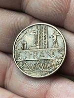 Obverse showing 10 FRANCS denomination and industrial design