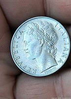Obverse of the 1973 Italy 100 Lire coin showing laureate female head and legend REPUBBLICA ITALIANA