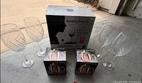 Box of aerating wine glasses with four glasses and two boxed Moscow Mule mugs