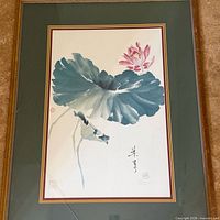 Full view of framed painting showing lotus flower artwork