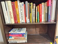 Full bookshelf view showing majority of titles on two shelves