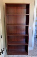 Front view showing full height and all five shelves
