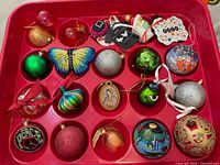Top view of Sterilite tray showing assorted ornaments in individual compartments