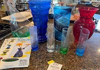 Group shot showing all glass vases, bud vases, Wonder Vase and leaflet