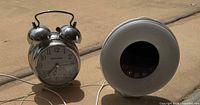 Crosley twin-bell clock and HomeLabs sunrise clock side by side