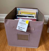 Storage cube filled with books showing spines