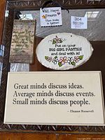 All four plaques grouped to show sizes and designs