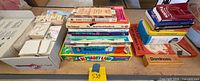 Table view showing books, games, cassettes, dominoes, flashcards box