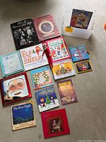 Overhead view showing full assortment of holiday books and Elf doll
