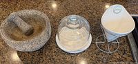 Granite mortar and pestle, marble plate with glass dome, ceramic fry cone on stand