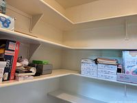 Overall view of shelves with paper products, envelopes, photo pages, folders, index card boxes and holders