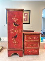 Front view of both jewelry boxes closed, showing painted design and size comparison