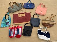 Group shot of all ten bags arranged on the ground