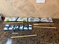 overview of bamboo straws, brushes and three patterned fabric wraps
