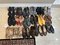 Group shot showing all 16 pairs arranged on floor