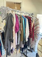 Full rack of assorted women’s garments on hanging rack