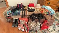Overview of entire lot showing scarves, shoes, bags, gloves, hats