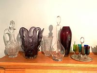 Overall lot showing all glass pieces on shelf