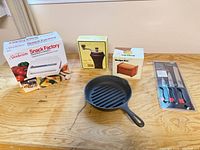All five kitchen items grouped on table
