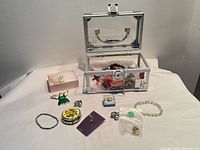 Overview of jewellery case and assorted costume jewellery items