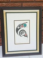 Full view of framed Indigenous print showing frame, mat and image
