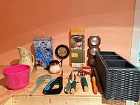 Full lot overview showing all garden items and tools on tabletop