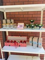All four glassware sets displayed on shelving