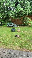 Both ceramic planters shown side by side in yard
