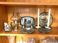 Overall lot showing all pewter pieces on shelf