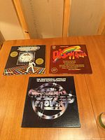 Three record sleeves front view on table