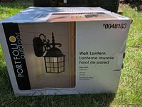 Front of Portfolio Outdoor wall lantern box showing product image and model number