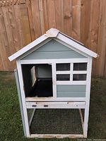 Front view showing enclosed house section, sliding tray and wire mesh lower run