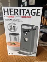 Front of retail box showing Heritage XL electric can opener and features
