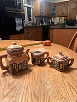 Group view of teapot, creamer, sugar bowl