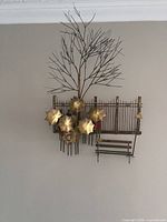 Sculpture hanging on wall showing overall composition