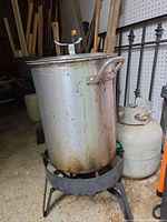 Pot on burner stand with visible wear